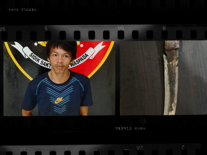 Tersangka Yos saat diamankan pihak kepolisian.