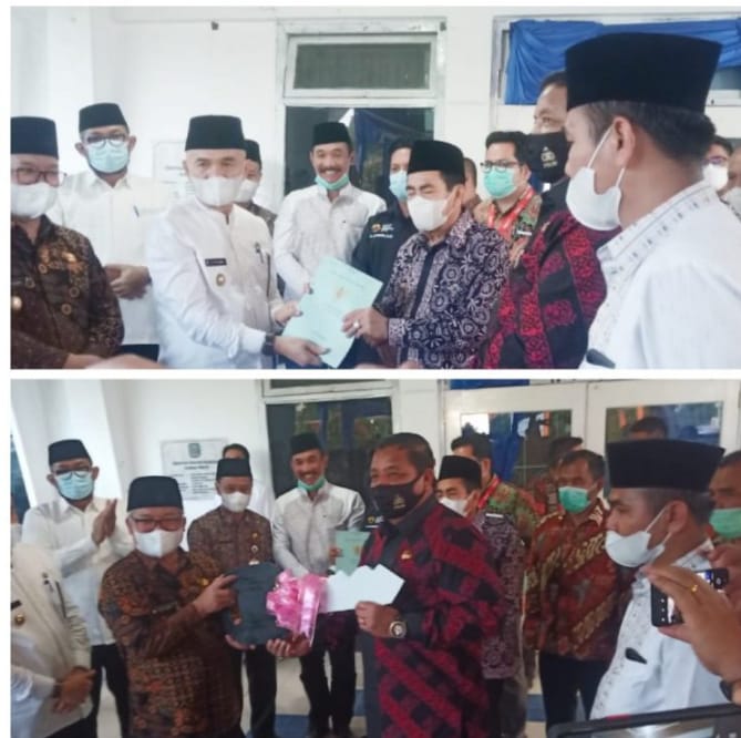 Prosesi serah terima aset dari Pemkab Kerinci ke Pemkot Sungai Penuh