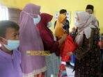pemberian bantuan paket Sembako dan santunan bagi anak yatim di Desa Sogo, Kecamatan Kumpeh