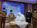 Penandatanganan Naskah Perjanjian Hibah Daerah (NPHD) antara Pemerintah Kabupaten Muaro Jambi dengan Pemerintah Provinsi Jambi